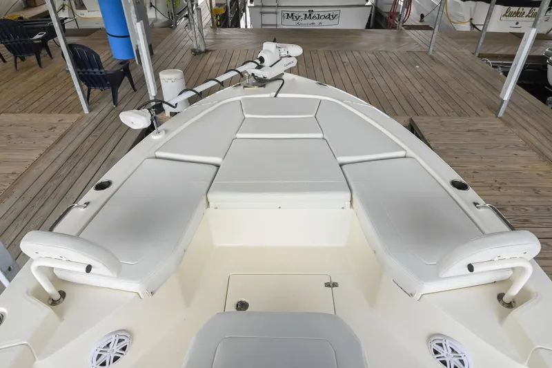 Slide: The Image of 2025 Pathfinder 2200 TRS boat interior with cushioned seating and deck view. - 45