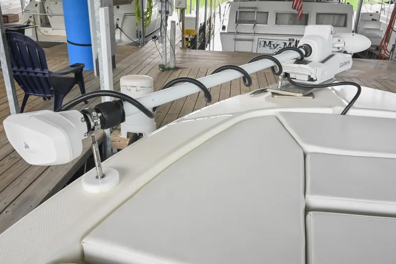 Slide: The Image of 2025 Pathfinder 2200 TRS boat with Garmin trolling motor docked in marina. - 49