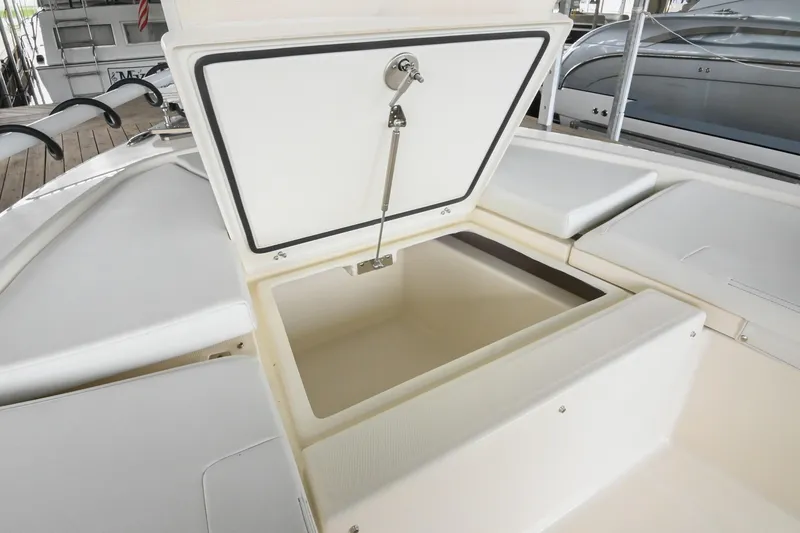 Slide: The Image of Open storage compartment on 2025 Pathfinder 2200 TRS boat deck. - 52