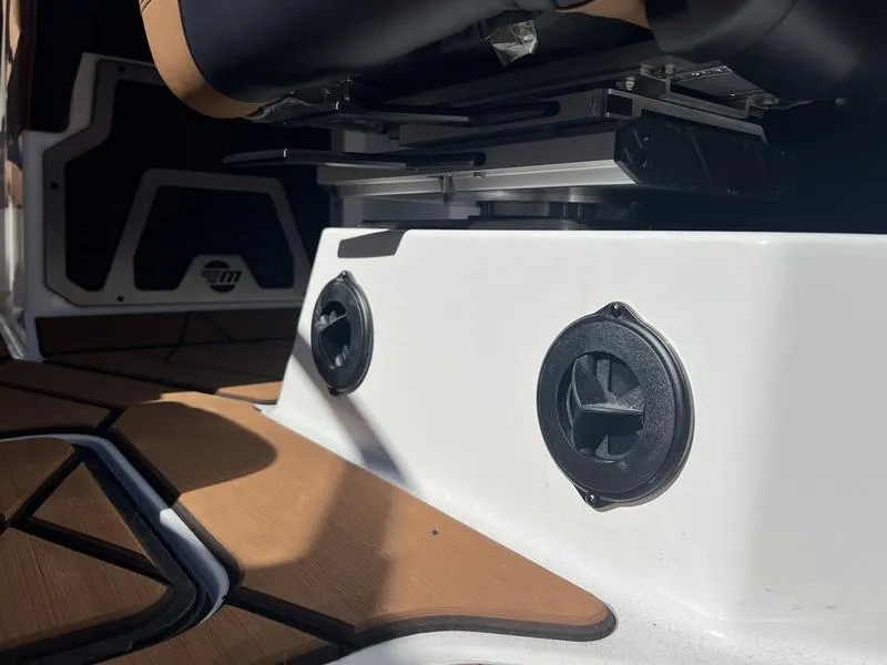 Slide: The Image of 2025 Malibu M230 boat interior with sleek design and modern fixtures. - 14