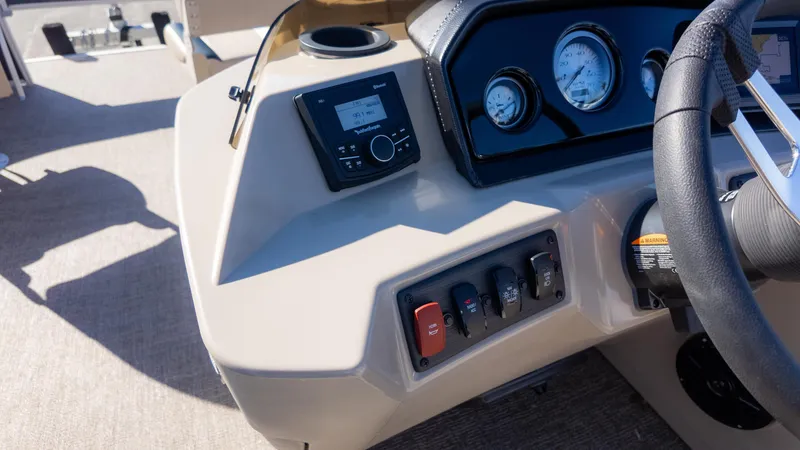 Slide: The Image of 2025 Bennington 21SF boat dashboard with steering wheel and control panel. - 12