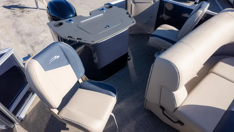 Slide: The Image of 2025 Bennington 21SF boat interior with beige and blue seating. - 17