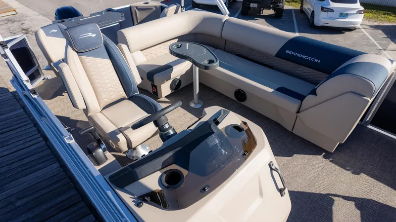 Slide: The Image of 2025 Bennington 21SF boat interior with luxurious seating and modern helm design. - 4