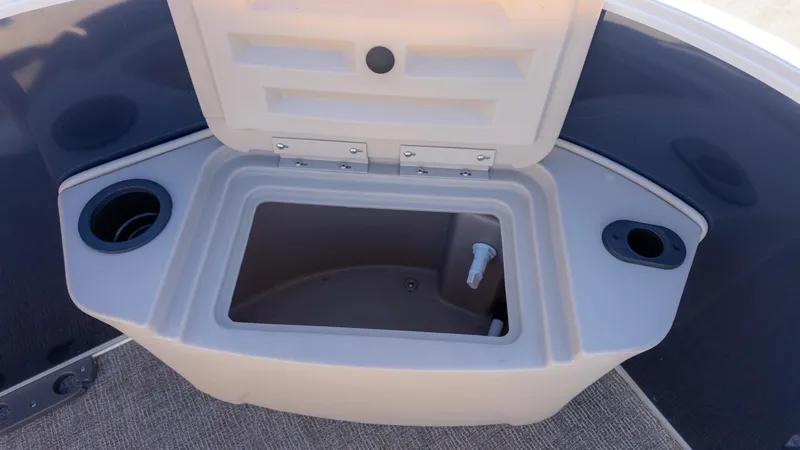 Slide: The Image of Open storage compartment on 2025 Bennington 21SF boat with cup holders. - 9