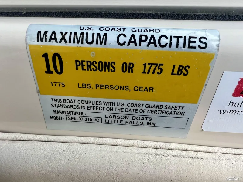 Slide: The Image of Larson 210 SEI 2002 boat capacity label: 10 persons or 1775 lbs. - 7