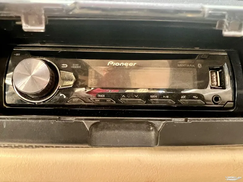 Slide: The Image of Pioneer car stereo in a 2002 Larson 210 SEI boat dashboard. - 9