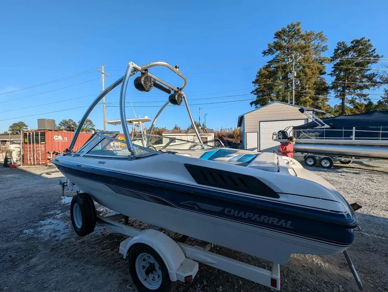 Slide: The Image of 1992 Chaparral 1900 SL boat on trailer in outdoor setting. - 3