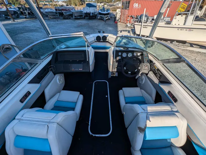 Slide: The Image of Interior of a 1992 Chaparral 1900 SL boat with blue and white seating. - 5