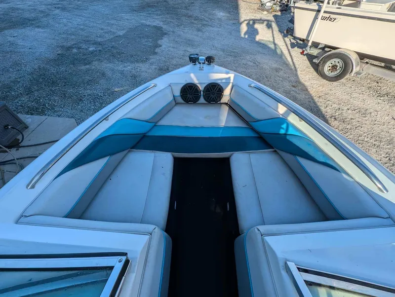 Slide: The Image of 1992 Chaparral 1900 SL boat interior with blue and white seating. - 6