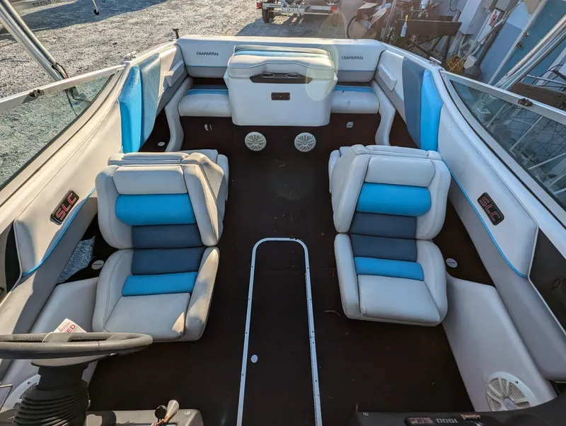 Slide: The Image of Interior of a 1992 Chaparral 1900 SL boat with blue and white seating. - 8