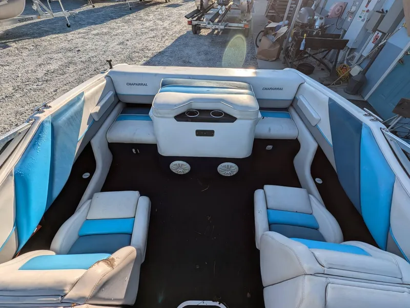 Slide: The Image of Interior of a 1992 Chaparral 1900 SL boat with blue and white seating. - 9