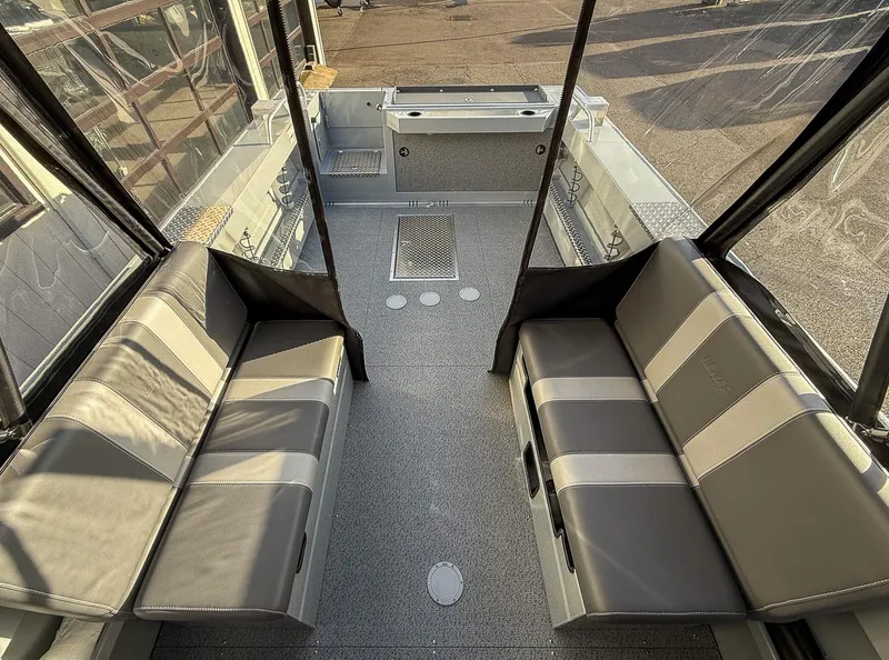 Slide: The Image of Interior of 2025 Hewescraft 210 Sea Runner ET with seating and storage. - 11