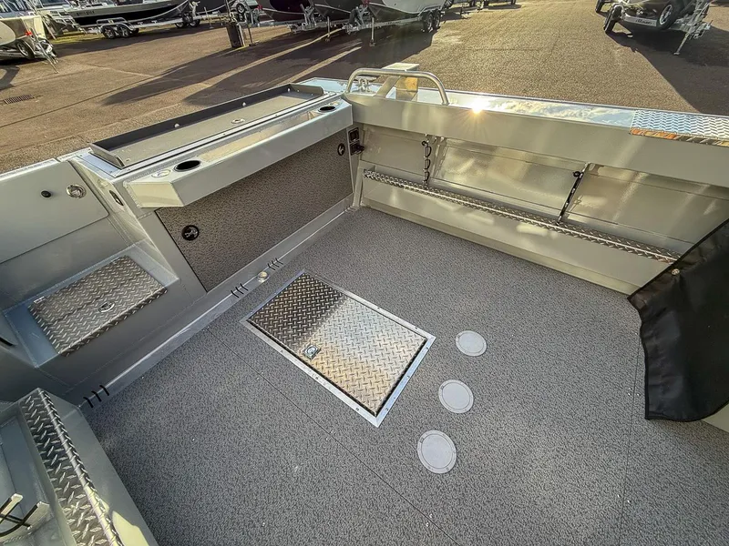 Slide: The Image of 2025 Hewescraft 210 Sea Runner ET boat interior with diamond plate flooring. - 13