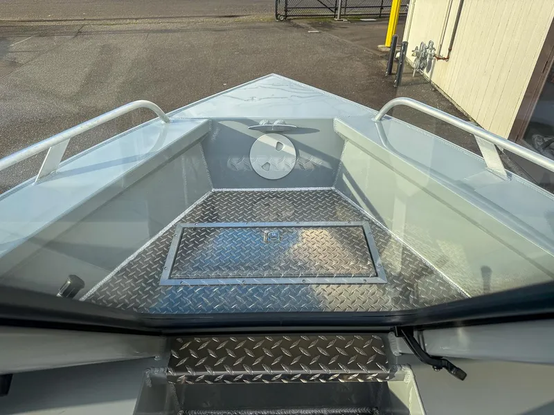 Slide: The Image of 2025 Hewescraft 210 Sea Runner ET boat interior with diamond plate flooring. - 7