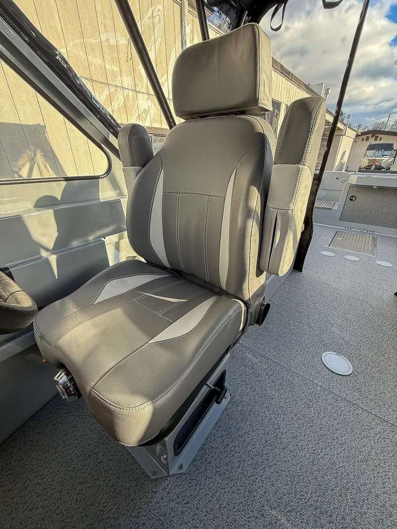 Slide: The Image of 2025 Hewescraft 210 Sea Runner ET interior seat, gray upholstery, modern design. - 9