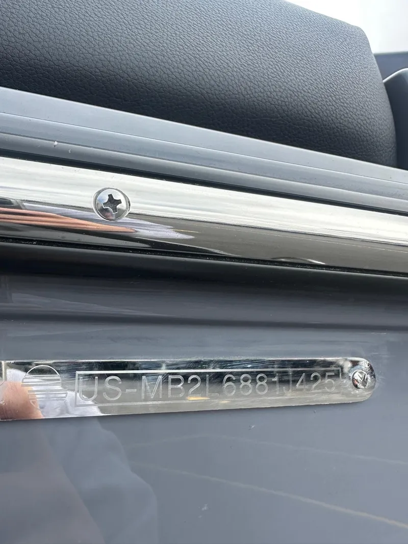 Slide: The Image of 2025 Malibu 24 MXZ boat identification plate with serial number. - 22