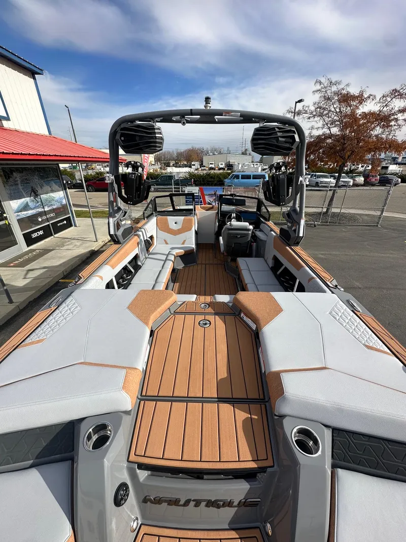 Slide: The Image of 2025 Nautique GS22 boat interior with sleek seating and modern design. - 10