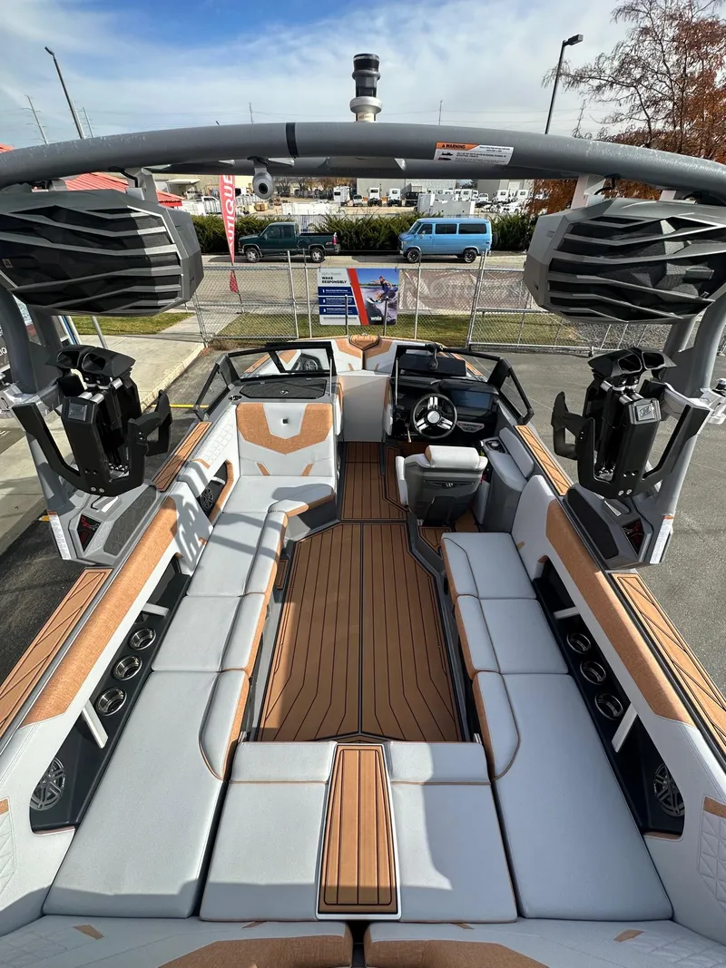 Slide: The Image of 2025 Nautique GS22 boat interior with spacious seating and modern design. - 11
