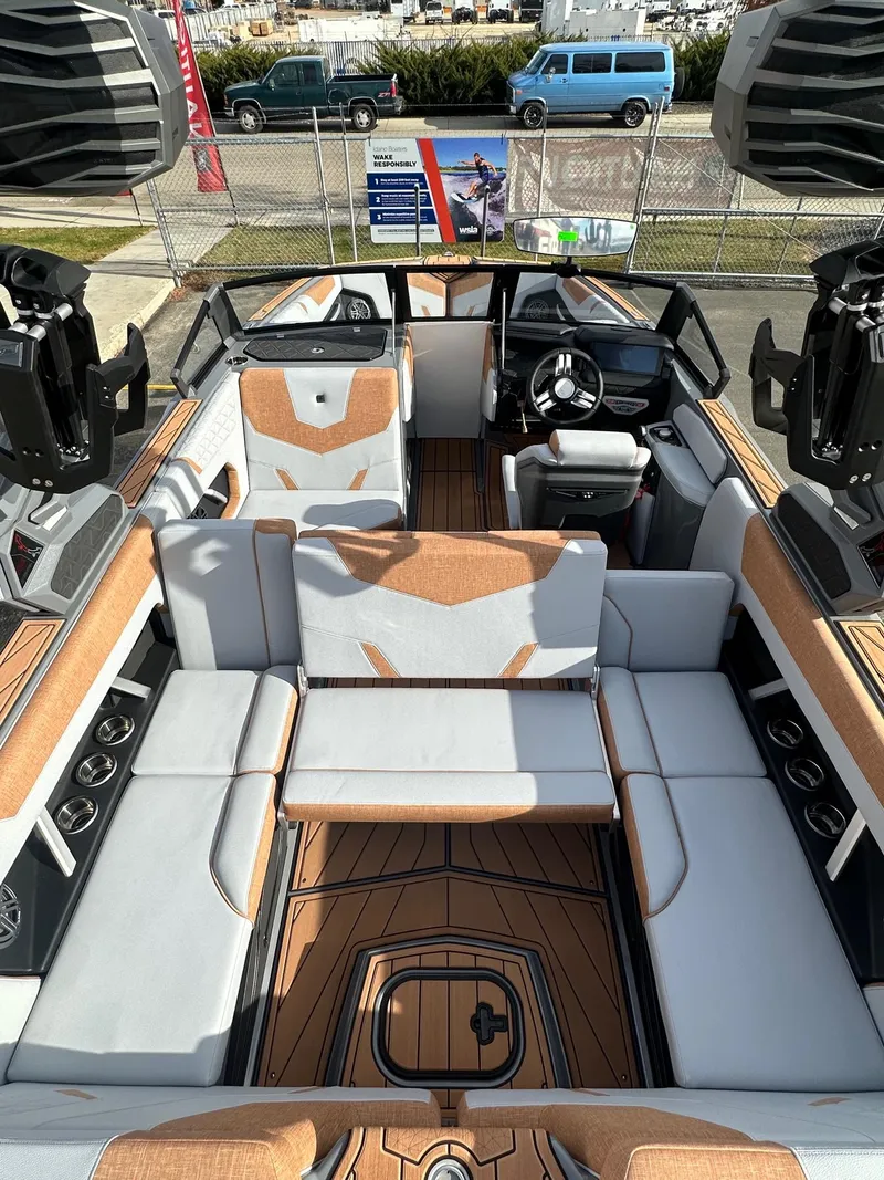 Slide: The Image of 2025 Nautique GS22 boat interior with luxurious seating and modern design. - 12