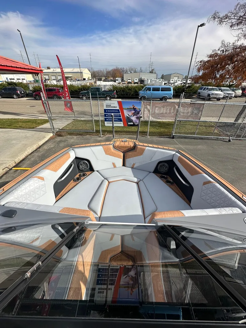 Slide: The Image of 2025 Nautique GS22 boat interior with modern seating and sleek design. - 13