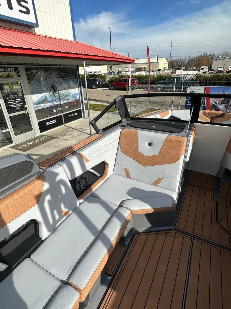 Slide: The Image of 2025 Nautique GS22 boat interior with stylish seating and modern design. - 17