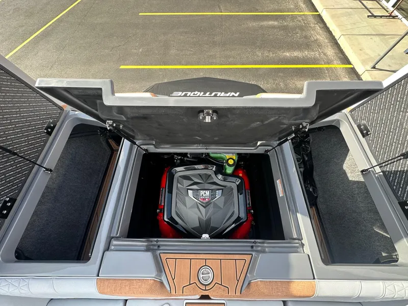 Slide: The Image of 2025 Nautique GS22 engine compartment with PCM engine, open hatch view. - 20