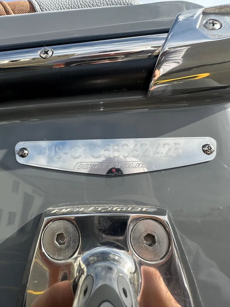 Slide: The Image of 2025 Nautique GS22 boat identification plate with serial number. - 23