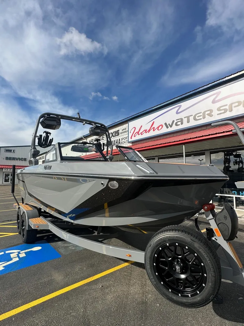 Slide: The Image of 2025 Nautique GS22 boat on trailer at Idaho Water Sports dealership. - 4