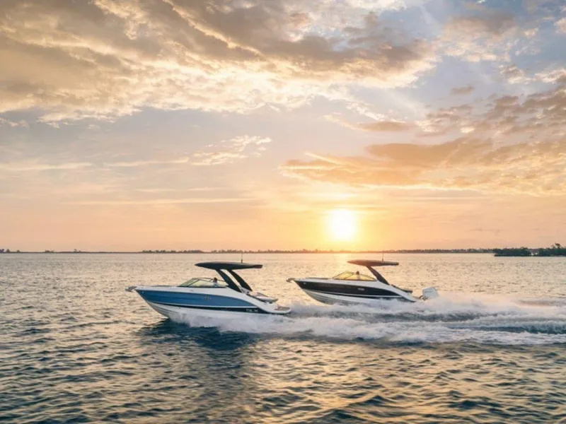 Slide: The Image of 2024 Sea Ray SLX 260 boats cruising at sunset on open water. - 2