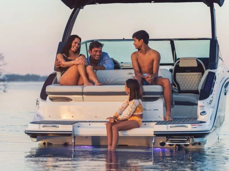 Slide: The Image of Family enjoying sunset on 2024 Sea Ray SLX 260 boat. - 3