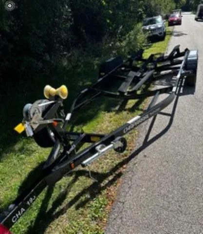 Slide: The Image of Trailer for 2020 Chaparral 257 SSX parked on roadside. - 20