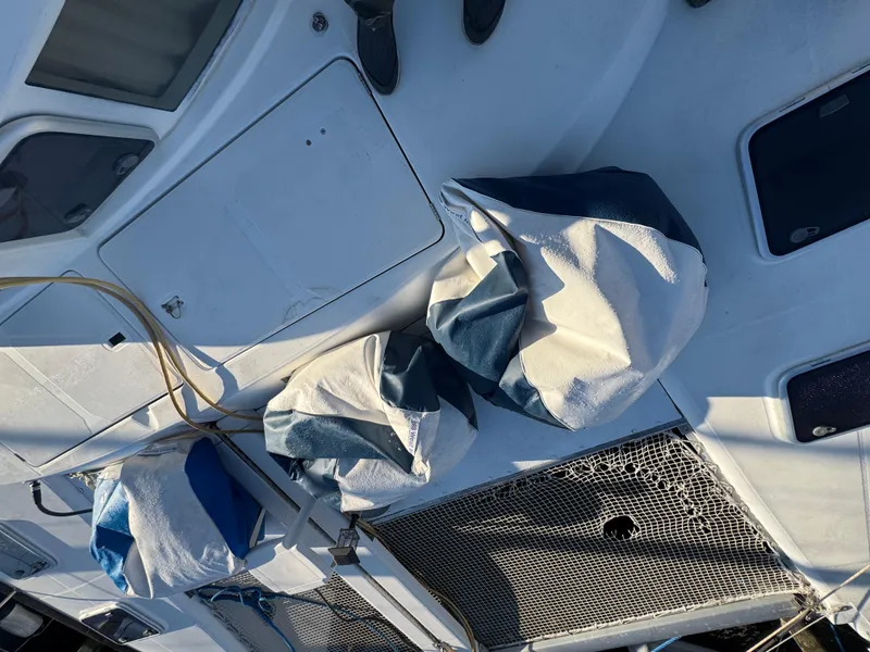 Slide: The Image of Lagoon 410 catamaran deck with sails and netting, 2001 model. - 11