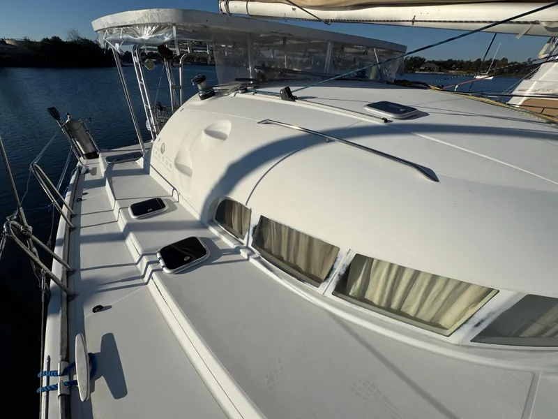 Slide: The Image of 2001 Lagoon 410 catamaran deck with sleek design and spacious layout. - 14