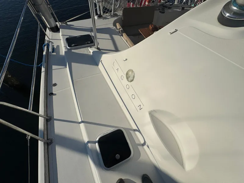 Slide: The Image of Lagoon 410 catamaran deck, 2001 model, with sleek white design and nautical features. - 18