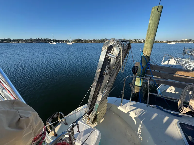 Slide: The Image of Lagoon 410 catamaran docked by serene waters, 2001 model. - 22