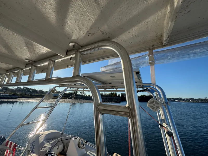 Slide: The Image of Lagoon 410 catamaran, 2001 model, docked with stainless steel railings and clear blue sky. - 23