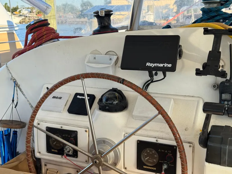 Slide: The Image of Steering wheel and navigation equipment on 2001 Lagoon 410 catamaran. - 26