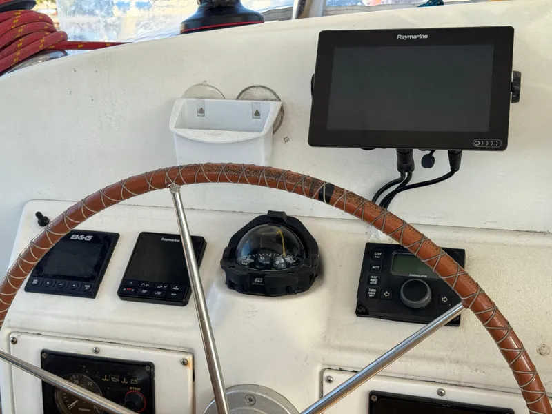 Slide: The Image of Lagoon 410 yacht helm with navigation instruments and compass, 2001 model. - 27