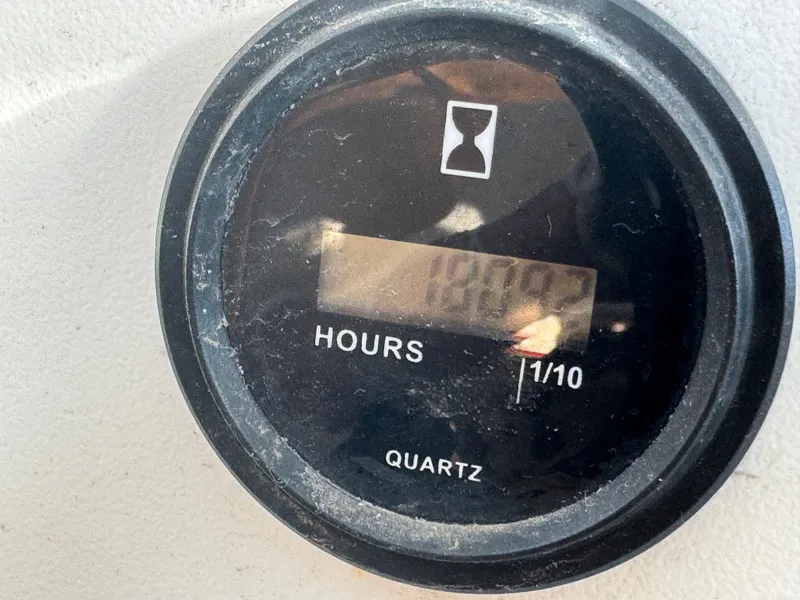 Slide: The Image of Hour meter showing 1810.2 hours on 2001 Lagoon 410. - 29