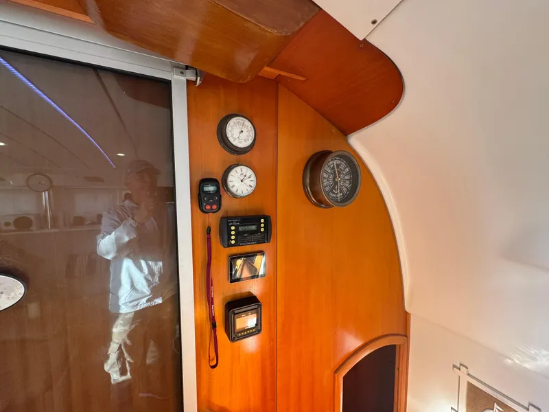 Slide: The Image of Interior of 2001 Lagoon 410 yacht with navigation instruments on wooden panel. - 37