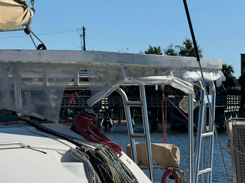 Slide: The Image of Lagoon 410 catamaran, 2001 model, docked with visible rigging and equipment. - 4