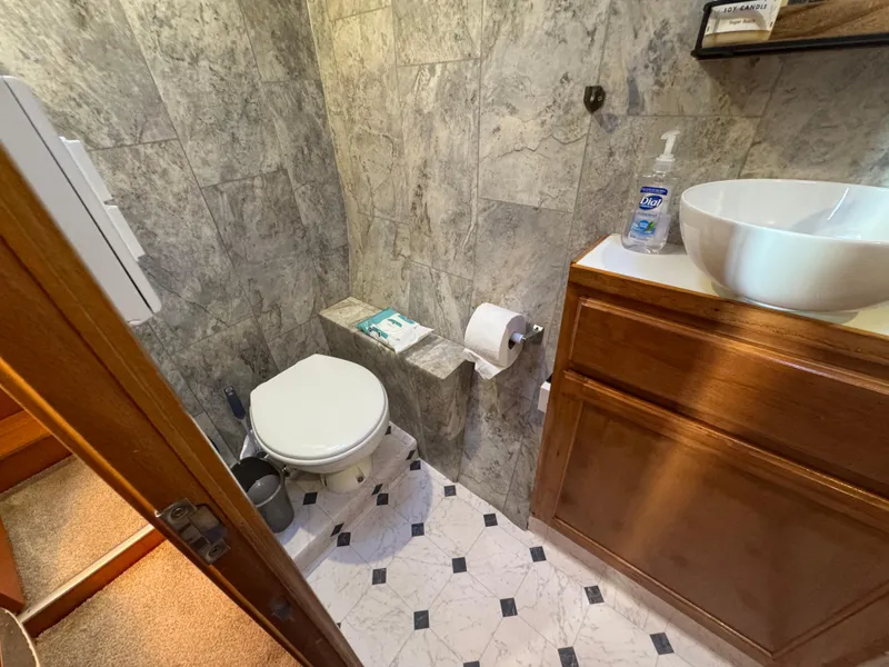 Slide: The Image of Bathroom in 2001 Lagoon 410 yacht with modern fixtures and wooden cabinetry. - 45