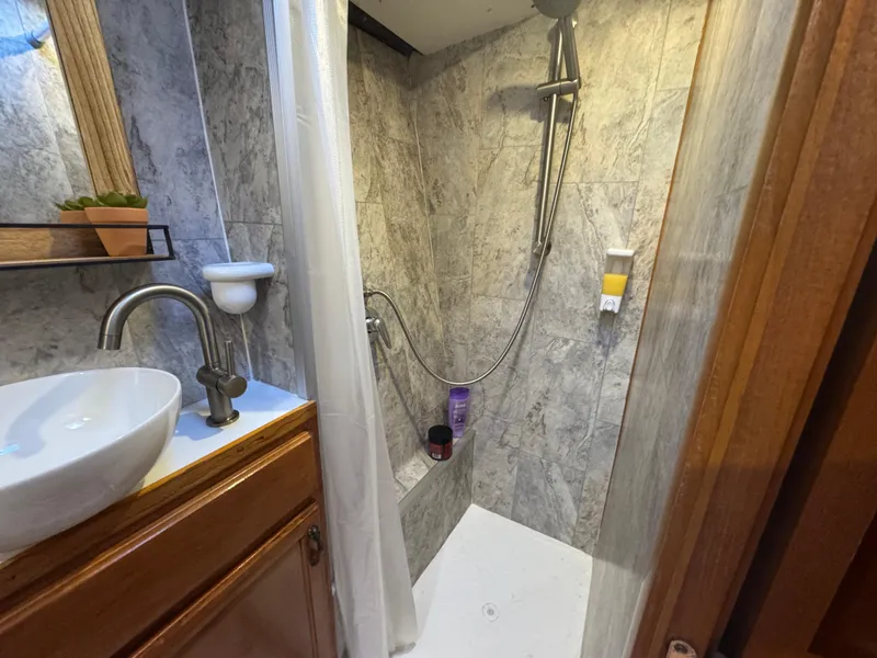 Slide: The Image of Compact bathroom with modern shower in 2001 Lagoon 410 yacht. - 46