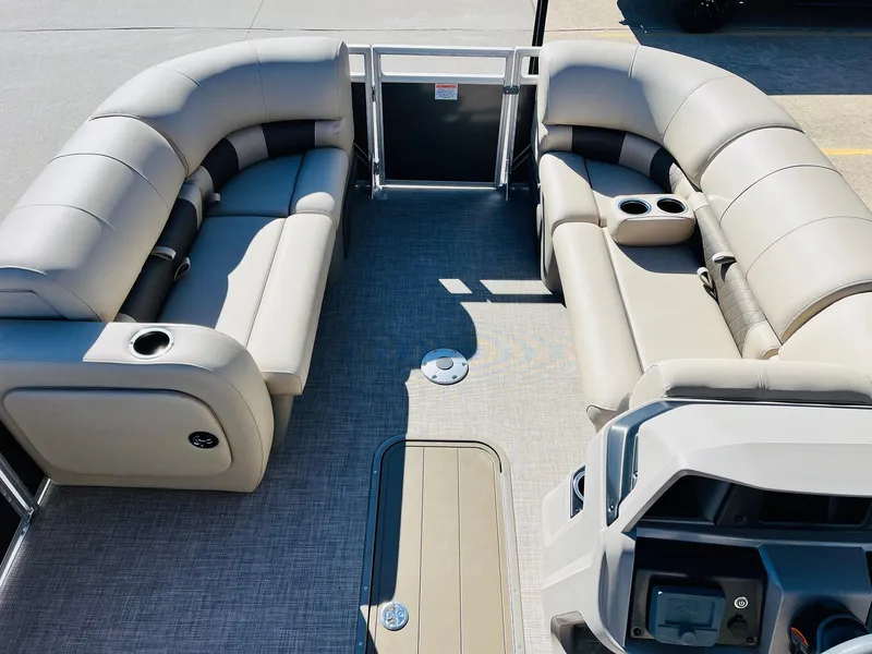 Slide: The Image of 2025 Sun Tracker Party Barge 22 RF XP3 interior with plush seating and modern console. - 11