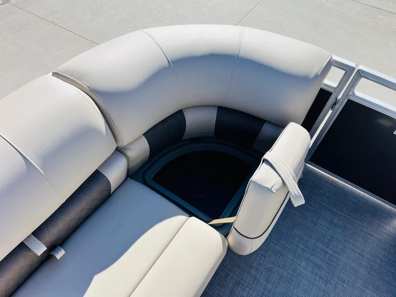 Slide: The Image of 2025 Sun Tracker Party Barge 22 RF XP3 seating area with storage compartment. - 16