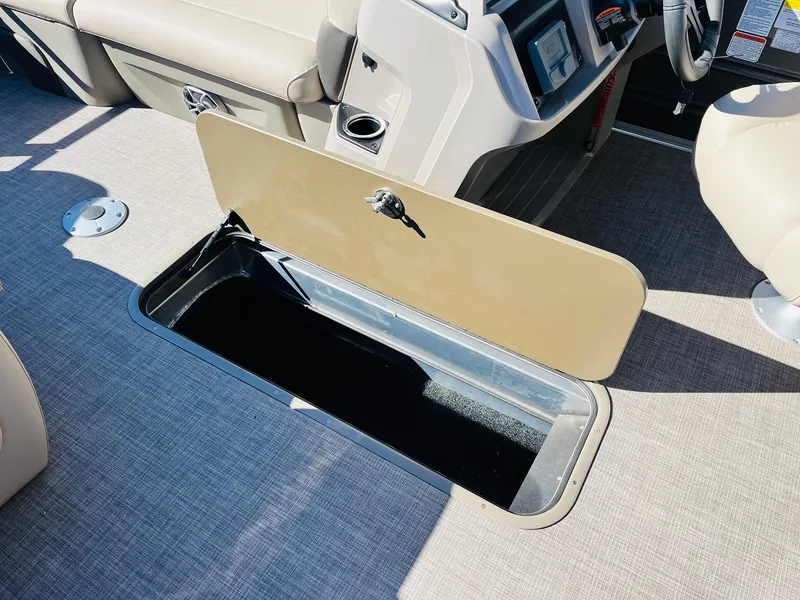 Slide: The Image of 2025 Sun Tracker Party Barge 22 RF XP3 storage compartment on deck. - 23