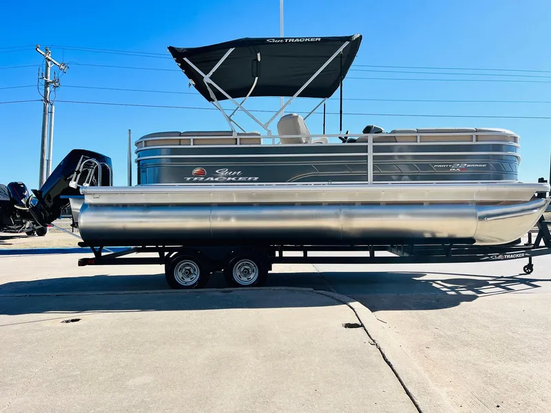 Slide: The Image of 2025 Sun Tracker Party Barge 22 RF XP3 pontoon boat on trailer. - 4