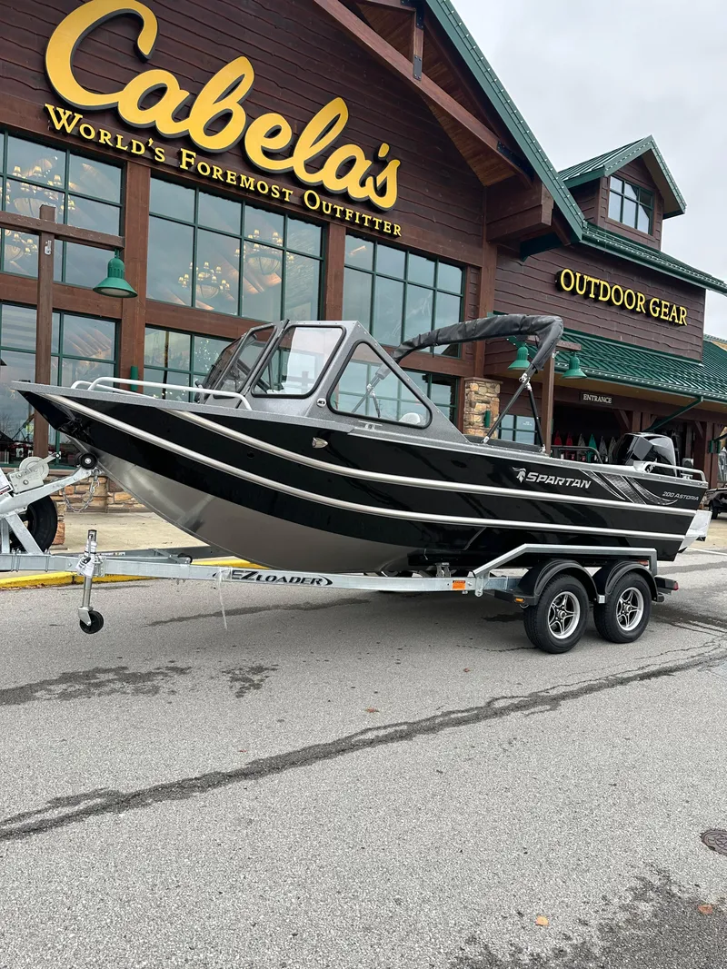 The Image of 2025 Spartan 200 Astoria boat on trailer outside Cabela's store. - 0
