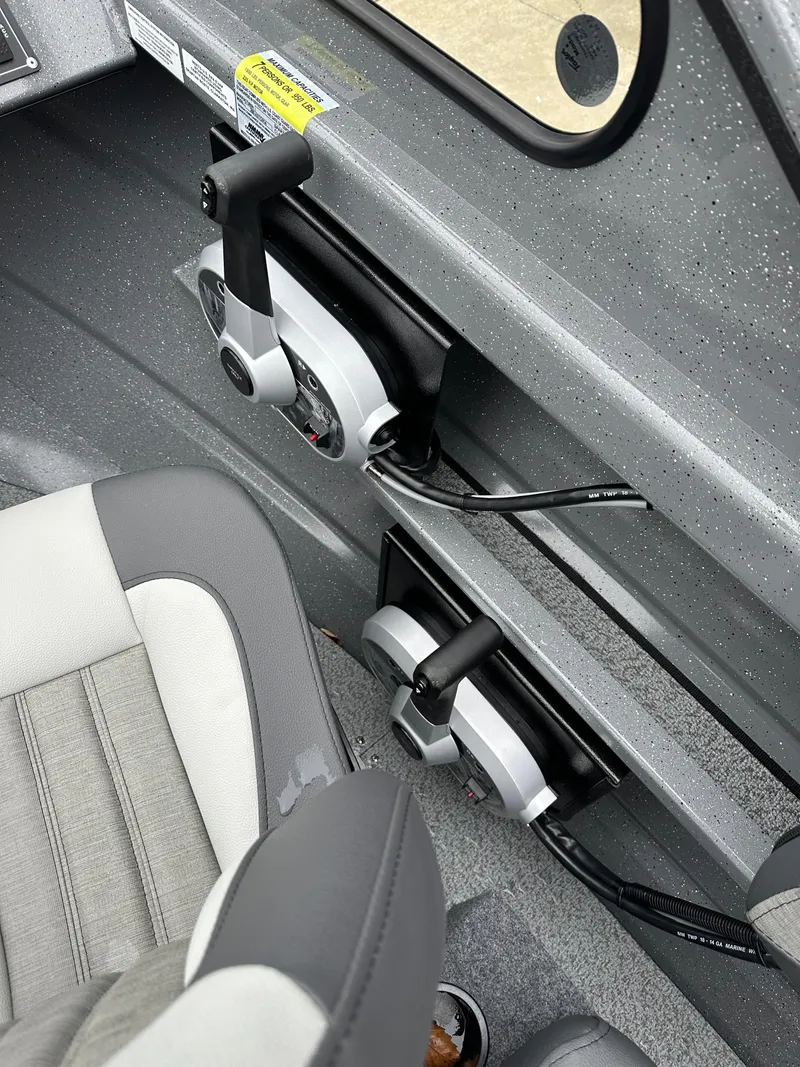 Slide: The Image of Interior controls of 2025 Spartan 200 Astoria boat, featuring modern design and ergonomic seating. - 10