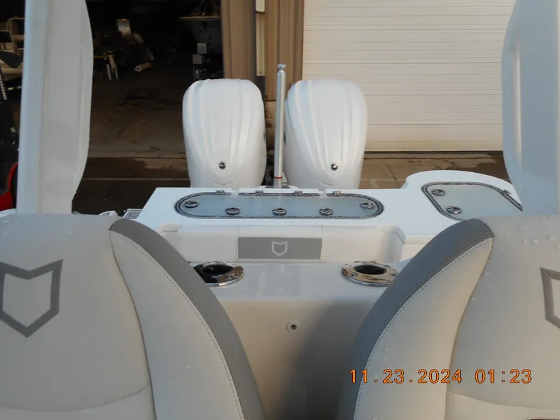 Slide: The Image of 2025 Sea Fox 288 Commander boat interior with dual engines. - 11